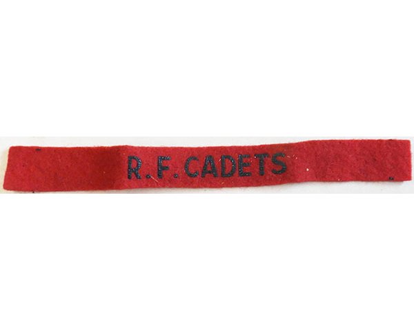 CST030. R.F.CADET, black printed on red wool, small size, unused
