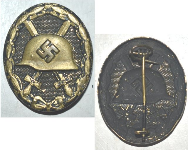 FM0584. WOUND BADGE 1939 in black, painted brass